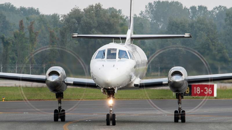 A small aeroplane getting ready to take off from the runway.