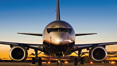 An executive airliner parked on a runway.