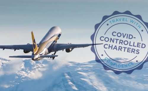 An image stamped with the words “COVID-CONTROLLED CHARTERS, TRAVEL WITH CONFIDENCE” shows an aircraft flying above snow-capped mountains.